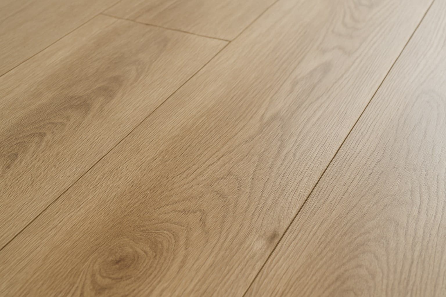 Close-up of textured wood grain on wide LVP planks showing matte finish detail