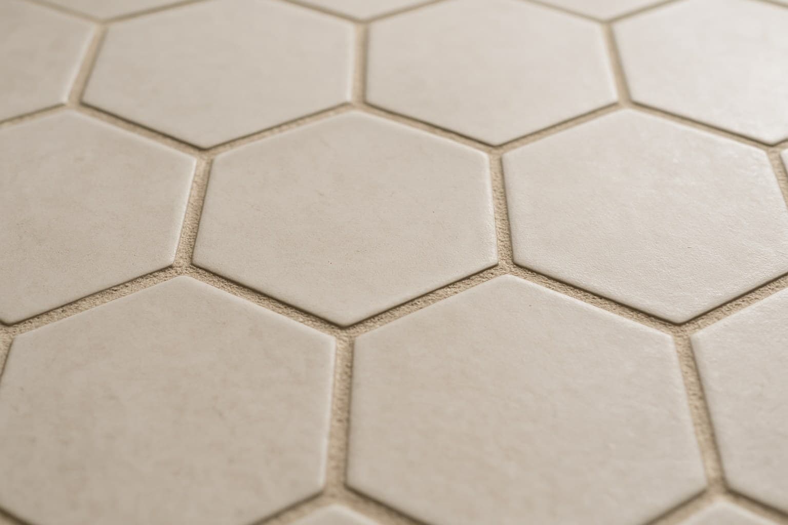 Close-up of grout lines between hexagon floor tiles