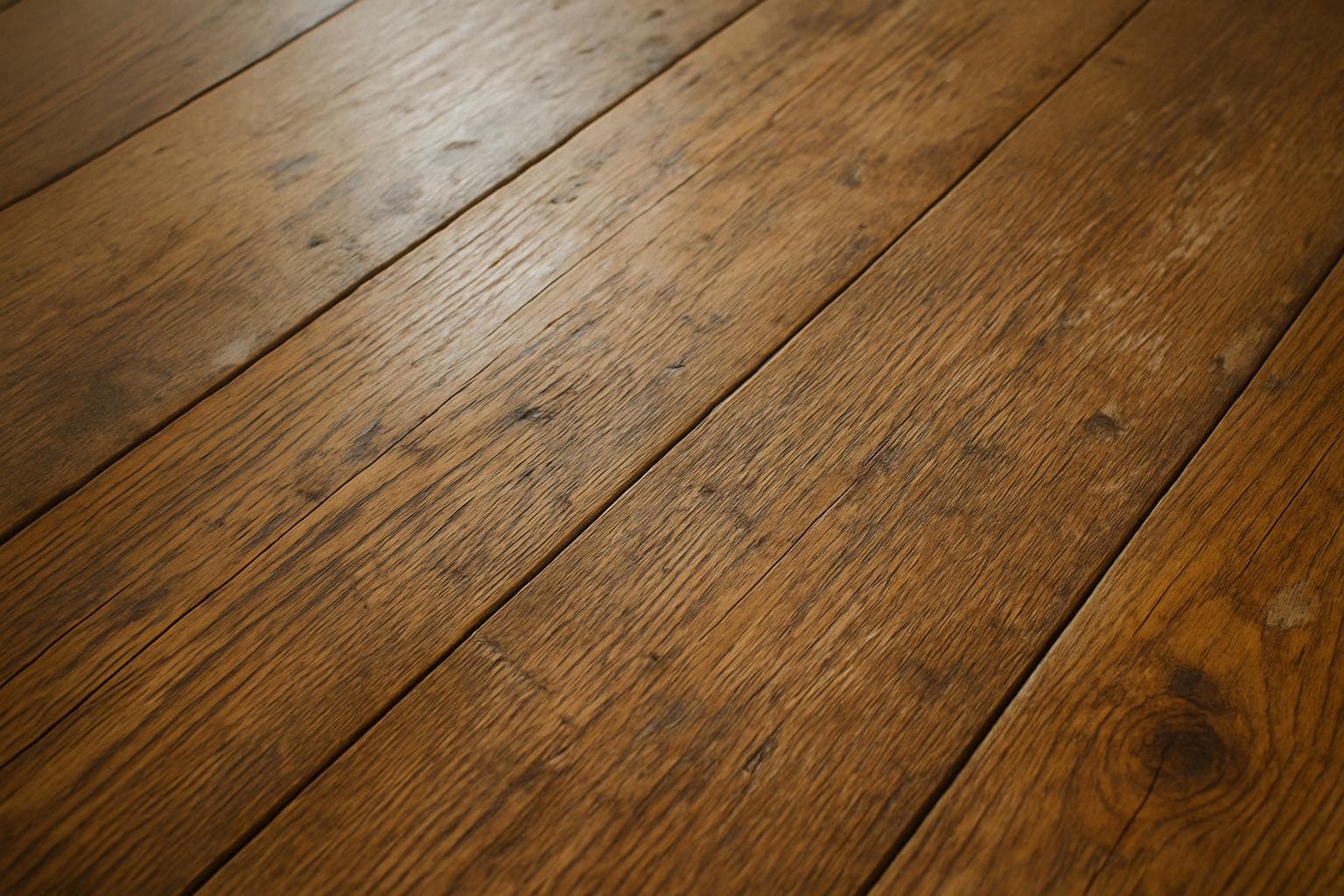 Close-up of a hardwood floor surface showing wear over time